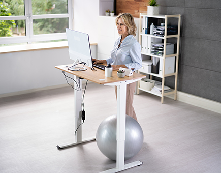 Older-Woman-Working-At-Standing-Desk.jpg
