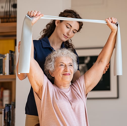 Elderly-Woman-With-Resitance-Band-And-Occupational-Therapist.jpg